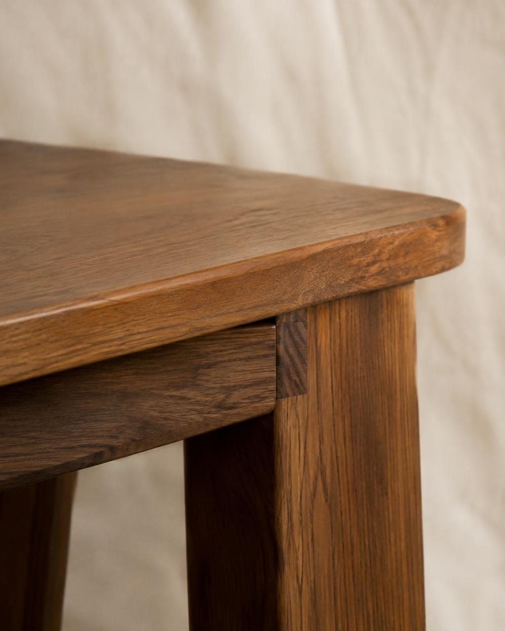 Hand-cut joinery on a teak table